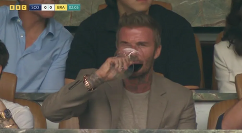 David Beckham drinks red wine at World Cup match