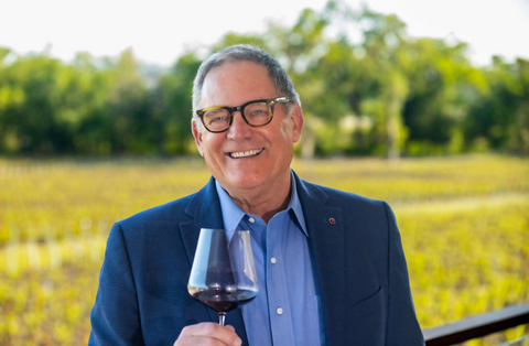 Opus One winemaker, Michael Silacci, holding glass of red wine