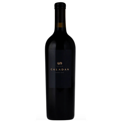 Black wine bottle with 'Caladan' label on a white background